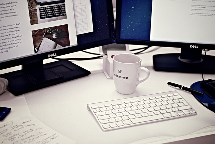 Dell computers sit on a desk